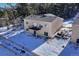 Rear view of the house showcasing the back exterior with a deck and walkout basement at 93 Greeley Blvd, Palmer Lake, CO 80133