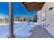 Inviting back patio with scenic views and a sliding glass door, perfect for enjoying the outdoors at 93 Greeley Blvd, Palmer Lake, CO 80133