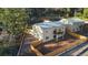Aerial shot of a serene backyard with a wooden fence, a balcony, and plenty of space for recreation and relaxation at 93 Greeley Blvd, Palmer Lake, CO 80133