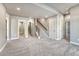 Spacious basement with carpet, stairs, and multiple doorways at 93 Greeley Blvd, Palmer Lake, CO 80133