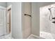 Bathroom featuring modern black fixtures and a tiled walk-in shower with decorative floors at 93 Greeley Blvd, Palmer Lake, CO 80133