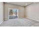 Bedroom featuring sliding doors that offer natural light and outdoor views at 93 Greeley Blvd, Palmer Lake, CO 80133