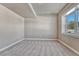 A cozy bedroom with modern finishes, a large window, and soft carpeting at 93 Greeley Blvd, Palmer Lake, CO 80133
