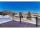An outdoor deck provides amazing views of snow-covered mountains at 93 Greeley Blvd, Palmer Lake, CO 80133