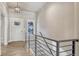 Bright entryway with wood flooring, staircase with modern railing, and natural light at 93 Greeley Blvd, Palmer Lake, CO 80133