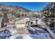 Beautiful single Gathering home in a neighborhood with an attached two car garage and blue door at 93 Greeley Blvd, Palmer Lake, CO 80133