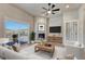 Cozy living room with a fireplace, large sliding door to the outside deck, and modern decor at 93 Greeley Blvd, Palmer Lake, CO 80133