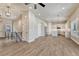 Open-concept living space featuring wood-look flooring, recessed lighting, and modern finishes at 93 Greeley Blvd, Palmer Lake, CO 80133