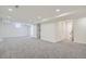 Finished basement offering ample living space with neutral carpeting at 71 W Fremont Ave, Littleton, CO 80120