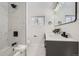 Modern bathroom with a walk-in shower and double vanity at 71 W Fremont Ave, Littleton, CO 80120