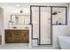 Spa-like bathroom with a large walk-in shower, soaking tub, and double vanity at 71 W Fremont Ave, Littleton, CO 80120