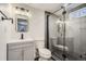 Basement bathroom with shower and floating vanity at 71 W Fremont Ave, Littleton, CO 80120