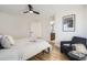 Bright bedroom with hardwood floors and an ensuite bathroom at 71 W Fremont Ave, Littleton, CO 80120