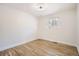 Bright bedroom featuring hardwood floors and a window at 71 W Fremont Ave, Littleton, CO 80120