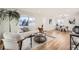 Bright and airy living room with hardwood floors, contemporary furniture, and large windows at 71 W Fremont Ave, Littleton, CO 80120