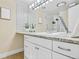 Bathroom featuring a granite countertop, ample light, and decorative tilework at 7865 E Mississippi Ave # 105, Denver, CO 80247