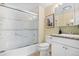 Bathroom with a tub and shower, a toilet and modern countertop with sink at 7865 E Mississippi Ave # 105, Denver, CO 80247