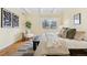 Bedroom featuring decor art, a cozy chair and an area rug at 7865 E Mississippi Ave # 105, Denver, CO 80247