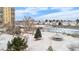 Aerial shot shows community amenities, including a gazebo, tennis courts, and beautifully landscaped grounds at 7865 E Mississippi Ave # 105, Denver, CO 80247