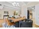 Charming dining room boasts a modern chandelier and natural light that flows into the living spaces at 7865 E Mississippi Ave # 105, Denver, CO 80247