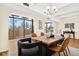 Bright dining room featuring modern lighting, large windows, and a wooden table at 7865 E Mississippi Ave # 105, Denver, CO 80247