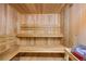 Interior view of a wooden sauna room with built-in benches, creating a relaxing atmosphere at 7865 E Mississippi Ave # 105, Denver, CO 80247