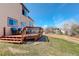 Relax on the wood deck with views of the landscaped backyard and neighborhood at 11020 Glacier Park Cir, Parker, CO 80138