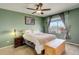 Cozy bedroom with ceiling fan, large window, and neutral color scheme provides a relaxing space at 11020 Glacier Park Cir, Parker, CO 80138