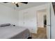 Bright bedroom featuring neutral carpet, a bed, and ample natural light, with doorway to other rooms at 11020 Glacier Park Cir, Parker, CO 80138