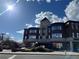 Three story commercial building featuring brick facade and arched windows at 11020 Glacier Park Cir, Parker, CO 80138