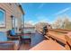 Spacious wooden deck with outdoor seating, a hot tub, and a grill perfect for relaxing and entertaining at 11020 Glacier Park Cir, Parker, CO 80138