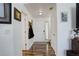 Bright foyer with hardwood floors and white walls offers a welcoming entry into this well-maintained home at 11020 Glacier Park Cir, Parker, CO 80138