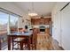 Charming kitchen dining area features stainless steel appliances, wood cabinetry, and sliding glass doors to the deck at 11020 Glacier Park Cir, Parker, CO 80138