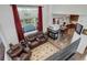Spacious living room with a fireplace and large windows provides ample natural light and views at 11020 Glacier Park Cir, Parker, CO 80138