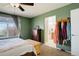 Serene bedroom with natural light, a dresser, and an en suite bathroom at 11020 Glacier Park Cir, Parker, CO 80138