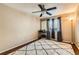 Neutral bedroom features wood floors, ceiling fan, and a patterned shag rug at 13960 Grape St, Thornton, CO 80602