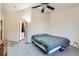 Cozy bedroom with comfortable bed, open closet, and soft lighting, creating a relaxing retreat at 13960 Grape St, Thornton, CO 80602