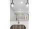 Spacious open finished basement showcasing a kitchenette and an open floorplan at 2990 S Juliet Ct, Strasburg, CO 80136