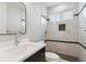 This bathroom features bright tiling, stainless steel fixtures, and a walk-in shower at 2990 S Juliet Ct, Strasburg, CO 80136