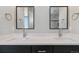 Bathroom vanity with double sinks and mirrors at 2990 S Juliet Ct, Strasburg, CO 80136