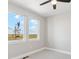 Bright bedroom with large windows and neutral carpet at 2990 S Juliet Ct, Strasburg, CO 80136