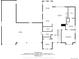 Floor plan showcasing the layout of the ground floor featuring a kitchen, dining, and garage at 2990 S Juliet Ct, Strasburg, CO 80136