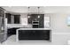 Beautiful kitchen with stainless steel appliances and a large center island at 2990 S Juliet Ct, Strasburg, CO 80136