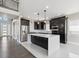 Spacious kitchen featuring a large island, stainless steel appliances and modern cabinetry at 2990 S Juliet Ct, Strasburg, CO 80136