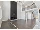 Grand living room with hardwood floors, tall ceilings and modern fireplace at 2990 S Juliet Ct, Strasburg, CO 80136