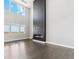 Bright living room showcasing tall windows and a modern fireplace feature at 2990 S Juliet Ct, Strasburg, CO 80136