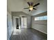 Sunlit bedroom featuring wood-look flooring and closet storage at 933 Reynolds Farm Ln # D7, Longmont, CO 80503