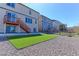 The backyard features artificial turf and gravel for easy maintenance at 4783 S Wenatchee Cir, Aurora, CO 80015