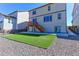 A lush artificial turf lawn enhances this backyard with wood fence at 4783 S Wenatchee Cir, Aurora, CO 80015