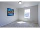 Bright bedroom with neutral colors, carpet floors, large window and charming decoration at 4783 S Wenatchee Cir, Aurora, CO 80015